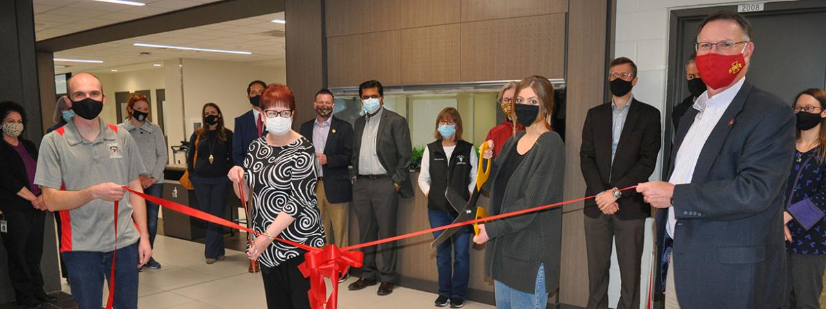 Fish tank lobby ribbon cutting ceremony