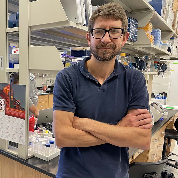 Josh Beck standing in lab