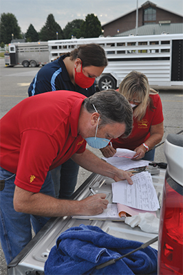 Veterinarians completing paperwork