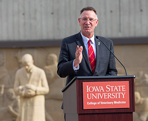 Dean Grooms standing at podium